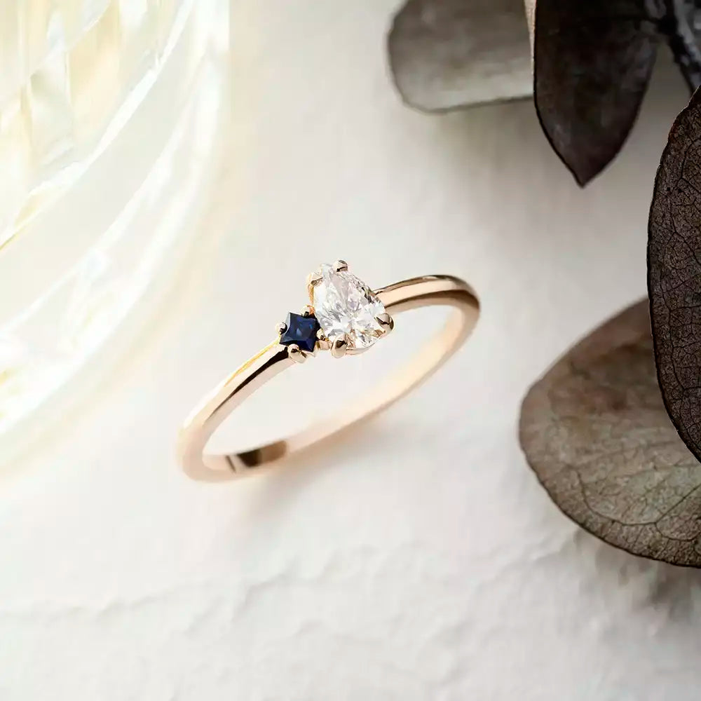 Deep 0.35 CT Pear Cut Diamond and Sapphire Rose Gold Ring