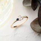 Deep 0.35 CT Pear Cut Diamond and Sapphire Rose Gold Ring