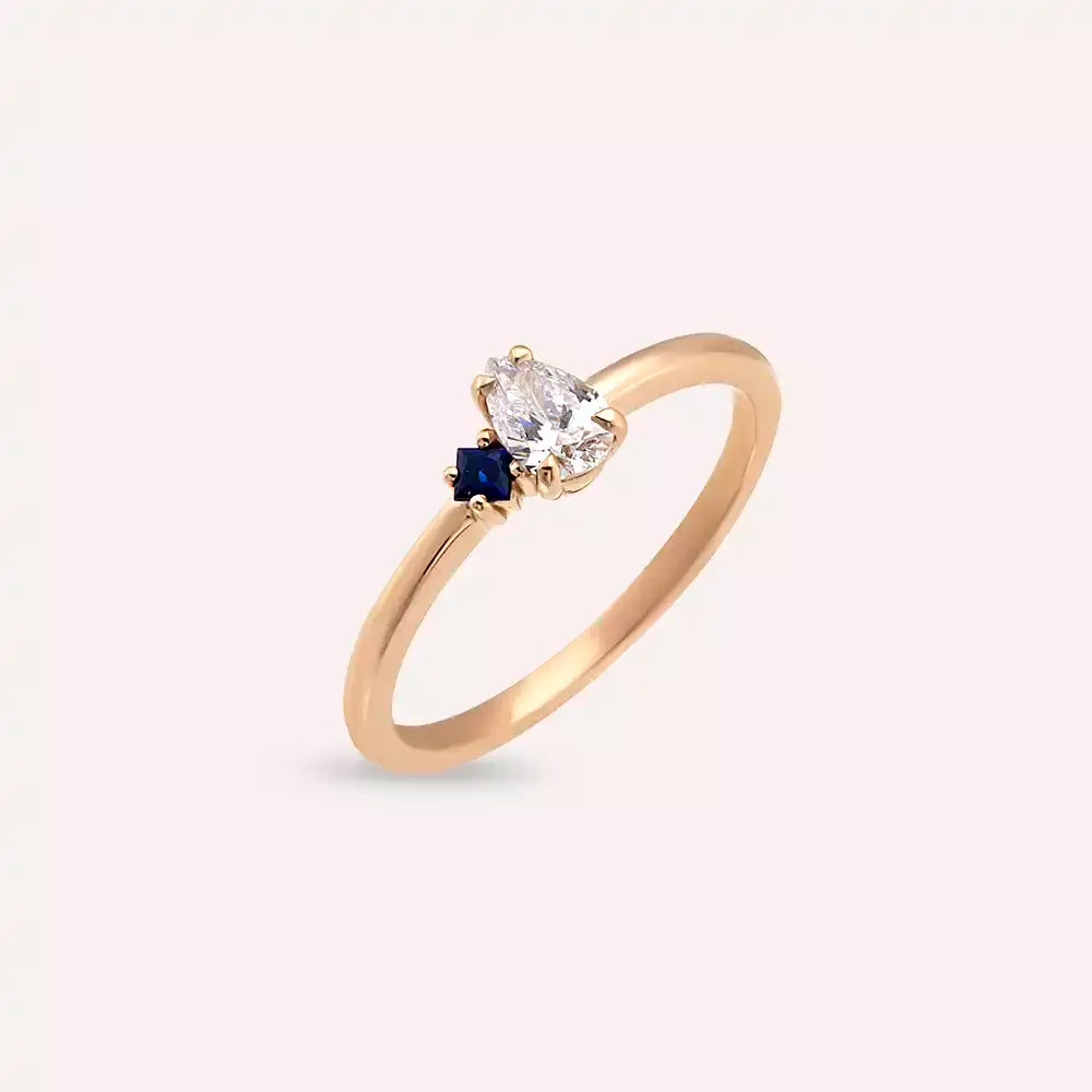 Deep 0.35 CT Pear Cut Diamond and Sapphire Rose Gold Ring